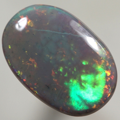 SOLID SEMI BLACK OPAL Large rolling flash of green and blue over sparkling red and orange See video
